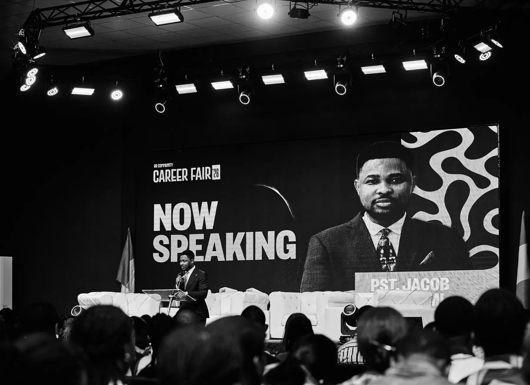 Jacob Odunlami speaking into a microphone